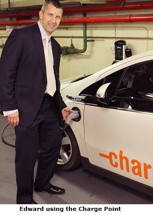 Edward using the Charge Point to recharge an electric car.